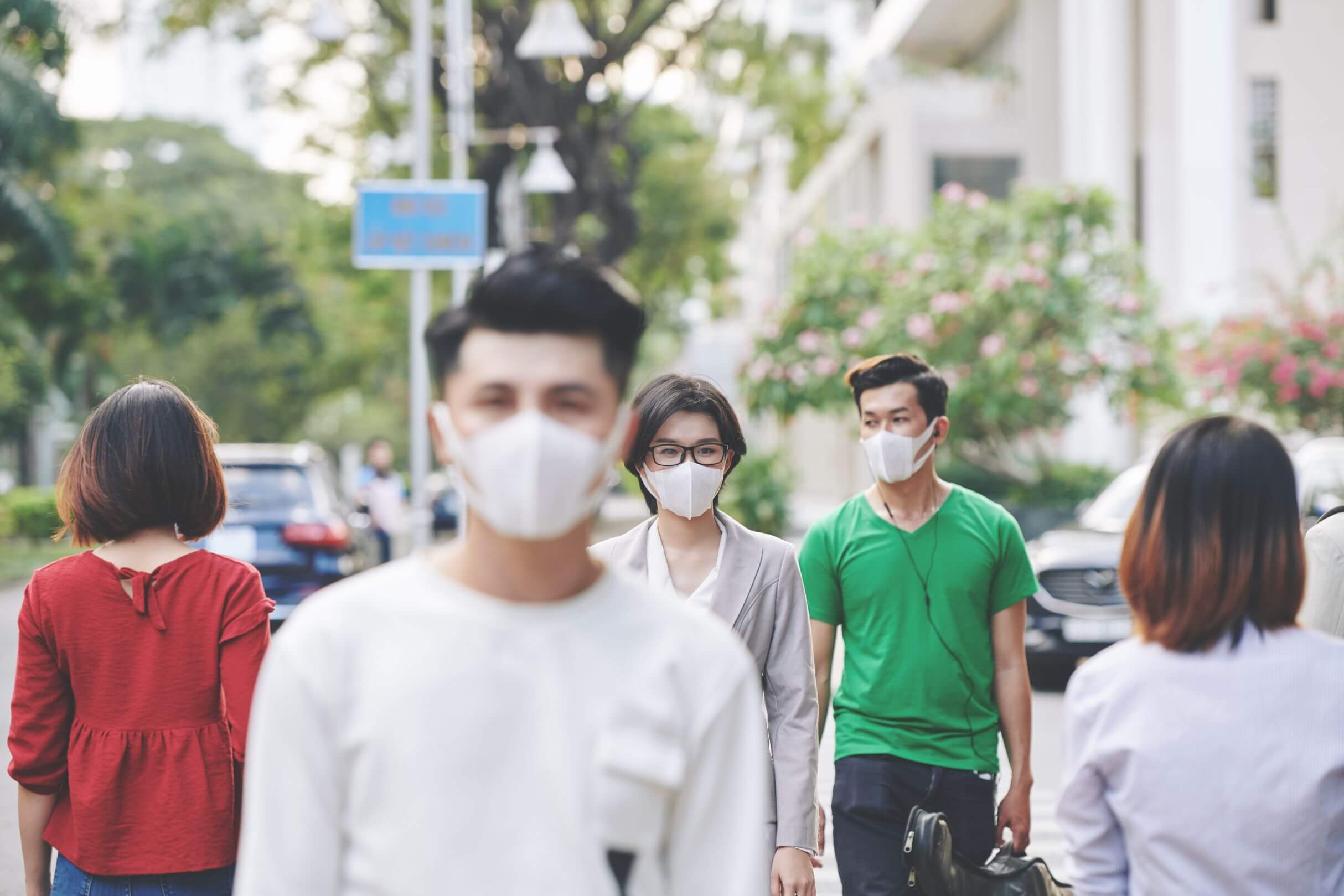 Group of people wearing Covid 19 masks.